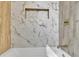Bathroom featuring a white tub and tiled walls at 1722 San Gabriel Ave, Decatur, GA 30032