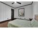 Comfortable bedroom featuring hardwood floors, a ceiling fan, and ample natural light at 1722 San Gabriel Ave, Decatur, GA 30032