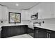 Modern kitchen featuring white cabinets, quartz countertops, and stainless steel appliances at 1722 San Gabriel Ave, Decatur, GA 30032