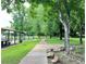 Scenic view of the community park, featuring walking paths, lush greenery, and a playground at 1722 San Gabriel Ave, Decatur, GA 30032
