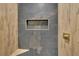 Elegant shower featuring stone tile and brass fixtures, enhancing the bathroom's luxury at 1722 San Gabriel Ave, Decatur, GA 30032