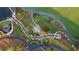 Beautifully landscaped community area featuring a serene stream, walking paths, and decorative stone features at 215 Rolison Way, Fayetteville, GA 30214