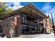 Charming brick building featuring an outdoor seating area, 'Barleygarden' sign, and inviting storefront at 215 Rolison Way, Fayetteville, GA 30214