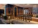 Evening view of modern brick hotel with arched windows and decorative lighting at dusk at 215 Rolison Way, Fayetteville, GA 30214