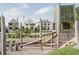 Community playground featuring modern play structures surrounded by well-maintained lawns and charming homes at 215 Rolison Way, Fayetteville, GA 30214