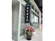 Outdoor counter for sushi restaurant Sensu with black sign on light green exterior with grey tile at 215 Rolison Way, Fayetteville, GA 30214