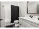 Bathroom featuring a tub with shower, white vanity, and black hardware at 481 Saddle Ridge Dr, Lawrenceville, GA 30046