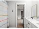 Bathroom featuring a double sink vanity with white cabinets, black hardware, and tile flooring at 481 Saddle Ridge Dr, Lawrenceville, GA 30046
