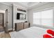 A bedroom featuring a queen sized bed, modern dresser, and an open doorway at 481 Saddle Ridge Dr, Lawrenceville, GA 30046