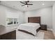 Cozy bedroom boasts a ceiling fan, neutral tones, and natural light through the window at 481 Saddle Ridge Dr, Lawrenceville, GA 30046