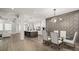 Open concept living and dining area with a dining table, stylish lighting, and modern design at 481 Saddle Ridge Dr, Lawrenceville, GA 30046