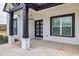 Charming front porch with black framed windows and a front door with glass panels at 481 Saddle Ridge Dr, Lawrenceville, GA 30046