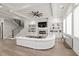 Bright living room features a coffered ceiling, fireplace, large windows, and open staircase at 481 Saddle Ridge Dr, Lawrenceville, GA 30046