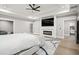 Main bedroom features a fireplace, TV, bathroom and walk in closet at 481 Saddle Ridge Dr, Lawrenceville, GA 30046