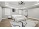 Serene main bedroom with tray ceilings, plush rug, and a stylish upholstered headboard at 481 Saddle Ridge Dr, Lawrenceville, GA 30046