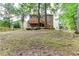 Expansive backyard with a wooden fence and mature trees at 58 Parkside Cir, Marietta, GA 30068