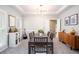 Elegant dining room with tray ceiling, stylish light fixture, and large windows offering ample natural light at 58 Parkside Cir, Marietta, GA 30068