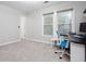 A bright office space with a desk, chair, and two large windows at 58 Parkside Cir, Marietta, GA 30068