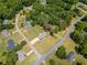 Aerial view showcasing the neighborhood, home and its nicely landscaped lot at 70 Heritage Way, Covington, GA 30016