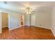 A spacious bedroom with wood-look flooring and a ceiling fan at 70 Heritage Way, Covington, GA 30016
