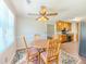 Charming dining area features a round table with seating for four and a decorative ceiling fan at 70 Heritage Way, Covington, GA 30016