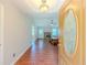 Entryway leading to a living room with fireplace, hardwood floors, and backyard access at 70 Heritage Way, Covington, GA 30016