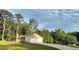 The home has a two-car garage, a well-maintained lawn, and mature trees that add to its curb appeal at 70 Heritage Way, Covington, GA 30016