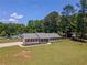 Well-maintained ranch-style home with a charming front porch, new roof, and driveway at 70 Heritage Way, Covington, GA 30016