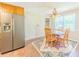 Eat-in kitchen features stainless steel refrigerator, and backyard access at 70 Heritage Way, Covington, GA 30016