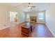 Living room with fireplace, ceiling fan and backyard access at 70 Heritage Way, Covington, GA 30016