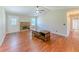 Living room with hardwood floors, brick fireplace and backyard access at 70 Heritage Way, Covington, GA 30016