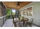 Relaxing screened-in back porch with string lights and wooded views, perfect for entertaining at 1066 High Point Ne Dr, Atlanta, GA 30306
