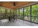 Relaxing screened-in back porch with string lights and wooded views, perfect for entertaining at 1066 High Point Ne Dr, Atlanta, GA 30306