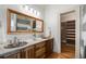 Elegant bathroom features double sinks, custom vanities, and a walk-in closet, enhancing the functionality at 1066 High Point Ne Dr, Atlanta, GA 30306