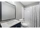 Charming bathroom offers a tub/shower combination, sleek vanity, framed mirror, and stylish tile at 1066 High Point Ne Dr, Atlanta, GA 30306