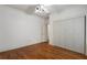 Bedroom featuring hardwood floors, a ceiling fan, and a large closet at 1066 High Point Ne Dr, Atlanta, GA 30306