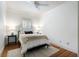Cozy bedroom with plush bedding, hardwood floors, and natural light from a window at 1066 High Point Ne Dr, Atlanta, GA 30306