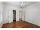 Large bedroom featuring hardwood flooring, a closet, and a doorway to another room at 1066 High Point Ne Dr, Atlanta, GA 30306