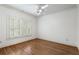 Bright and airy bedroom with hardwood floors and a window with plantation shutters at 1066 High Point Ne Dr, Atlanta, GA 30306