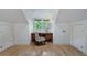 Bright bonus room with hardwood floors features a desk and storage between two closets at 1066 High Point Ne Dr, Atlanta, GA 30306
