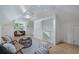 Cozy bonus room with light hardwood floors includes seating area and desk with a window view at 1066 High Point Ne Dr, Atlanta, GA 30306