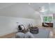 Bright bonus room features hardwood floors, natural light, and seating area with stylish decor at 1066 High Point Ne Dr, Atlanta, GA 30306