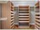 Spacious walk-in closet with custom shelving and drawer storage to maximize space at 1066 High Point Ne Dr, Atlanta, GA 30306