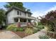 Exterior of a charming two-story home with a cozy front porch and well-manicured landscaping at 1066 High Point Ne Dr, Atlanta, GA 30306