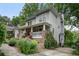 Two-story home with inviting front porch, showcases its curb appeal and charming neighborhood setting at 1066 High Point Ne Dr, Atlanta, GA 30306