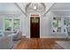 Bright entry foyer with hardwood floors, modern lighting, and views to the inviting front porch at 1066 High Point Ne Dr, Atlanta, GA 30306