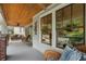 Inviting front porch with wood ceiling, comfortable seating, and natural light for relaxing outdoors at 1066 High Point Ne Dr, Atlanta, GA 30306