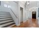 Inviting foyer features hardwood flooring, staircase, and entry door creating a warm welcome at 1066 High Point Ne Dr, Atlanta, GA 30306