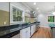 Gourmet kitchen features granite countertops, stainless steel appliances, and tile backsplash at 1066 High Point Ne Dr, Atlanta, GA 30306