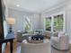 Cozy living room with neutral tones, comfortable seating, and views of the charming front porch at 1066 High Point Ne Dr, Atlanta, GA 30306